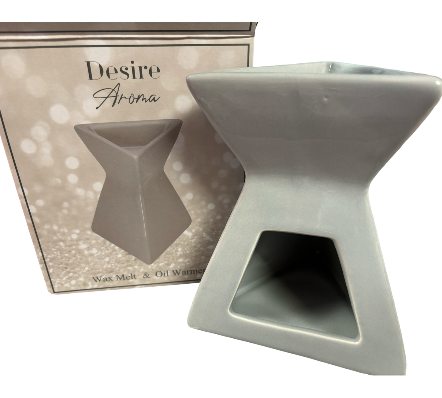 Triangle Grey Gloss Wax Melt & Oil Warmer by The Soap Gal x next to its box labeled "Desire Aroma." The warmer has a unique, angular design with a gray finish.